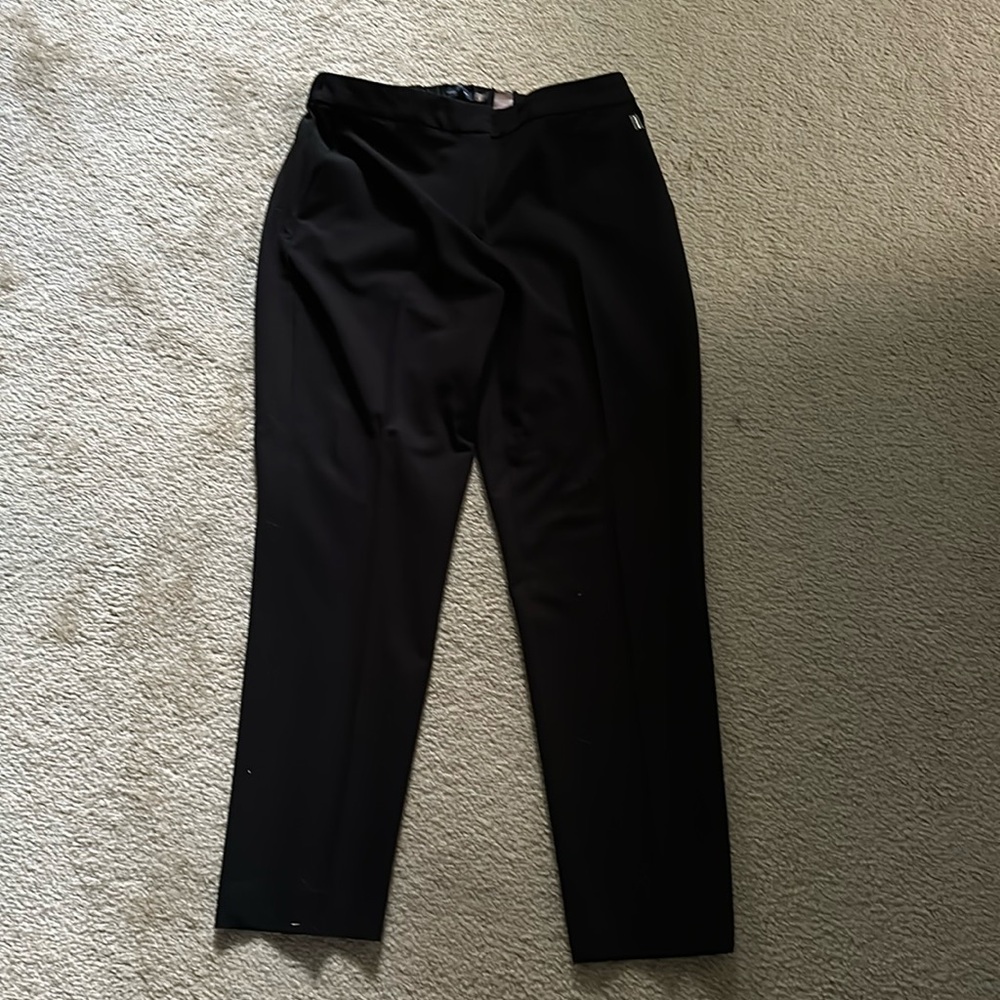 Slightly worn. Black suit pants.
